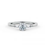 A classic engagement ring beautifully set with a round brilliant cut diamond & tapered baguettes
