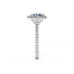 A stunning cushion halo engagement ring is beautifully set using a fine micro-claw